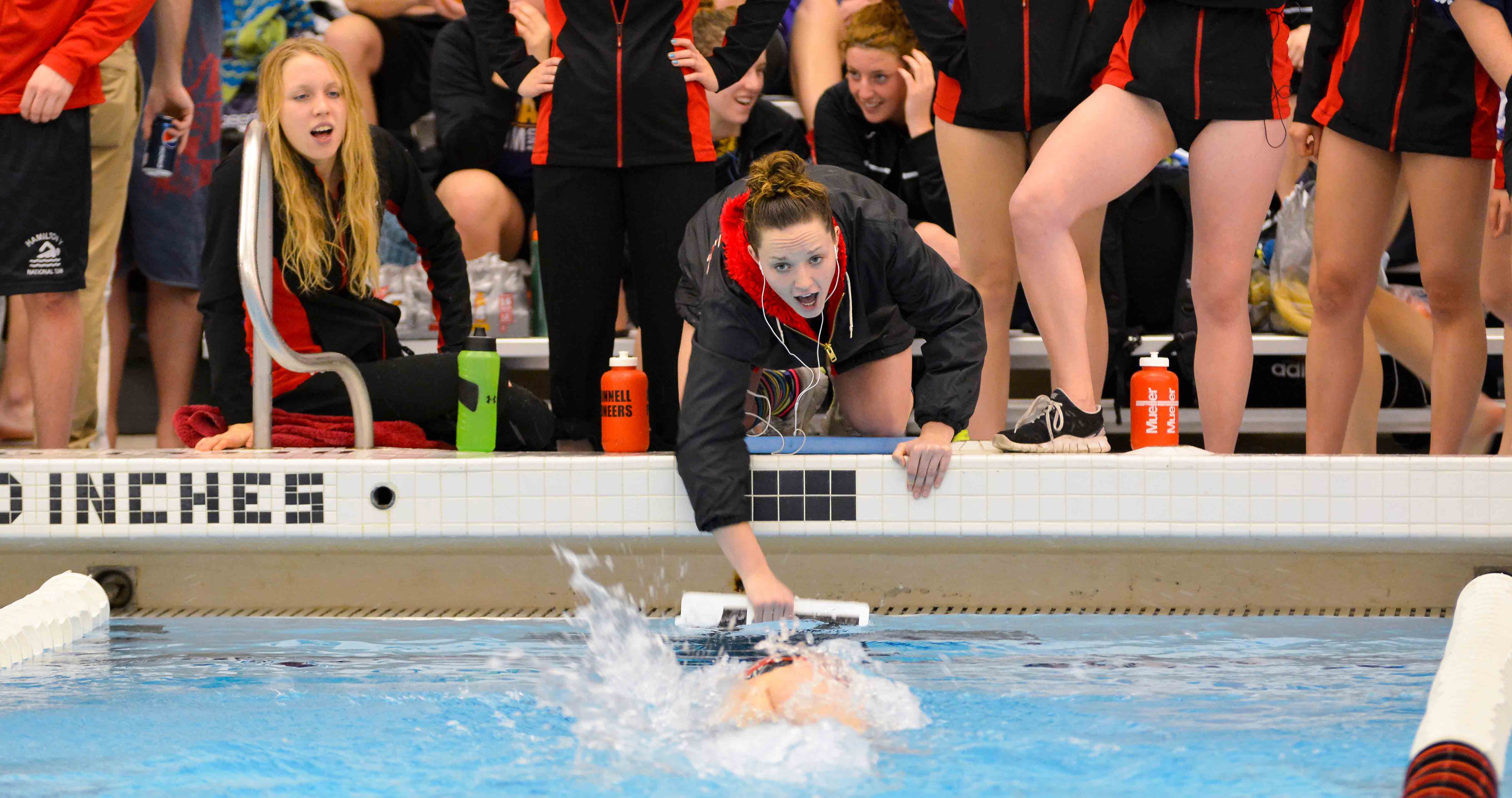 Callie Eyman-Casey coaching at Grinnell College